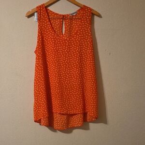 Vibrant Orange Sleeveless Blouse with Geometric Design